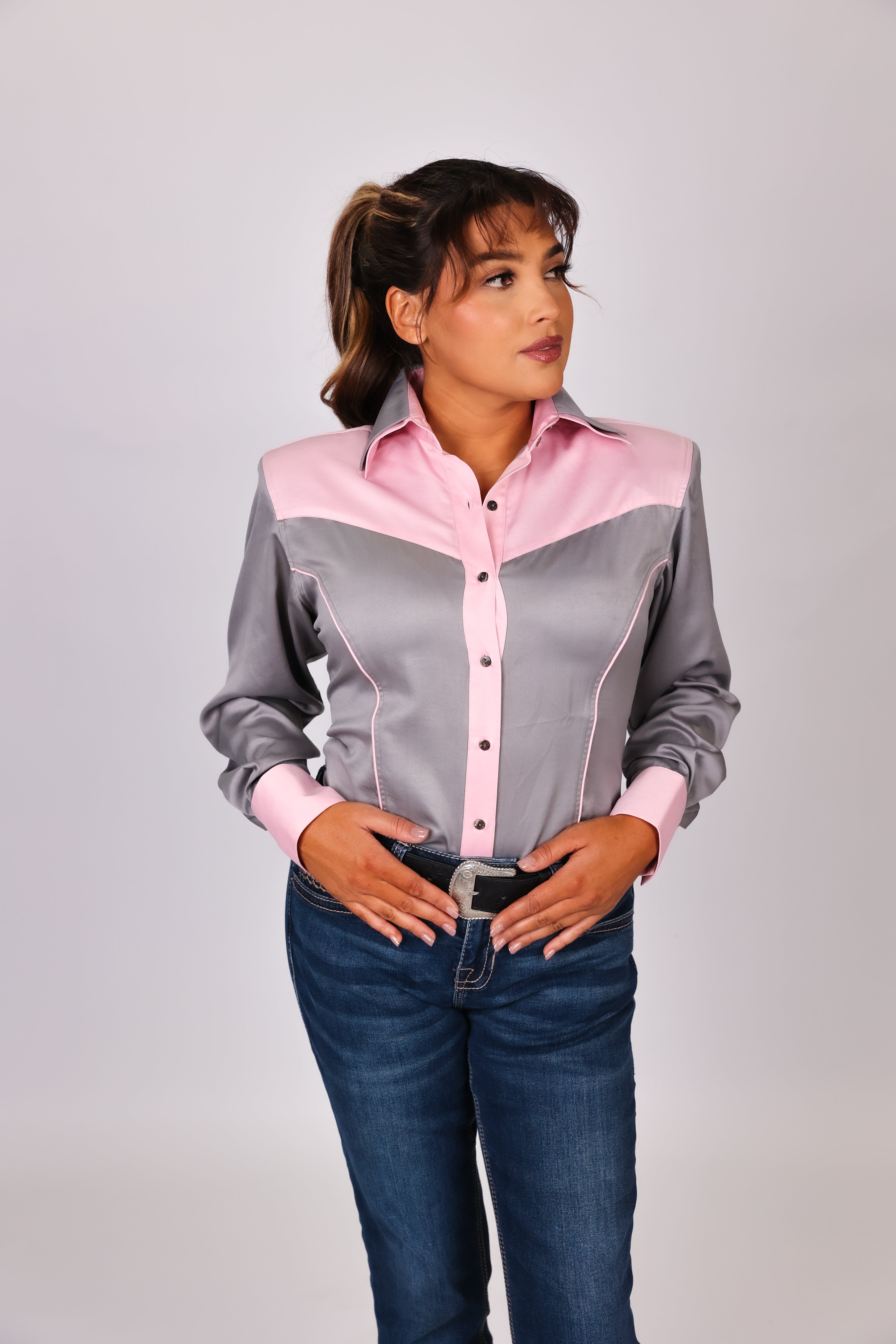 Model in studio setting posing in grey shirt from Carlee Collection by Kultured Rider