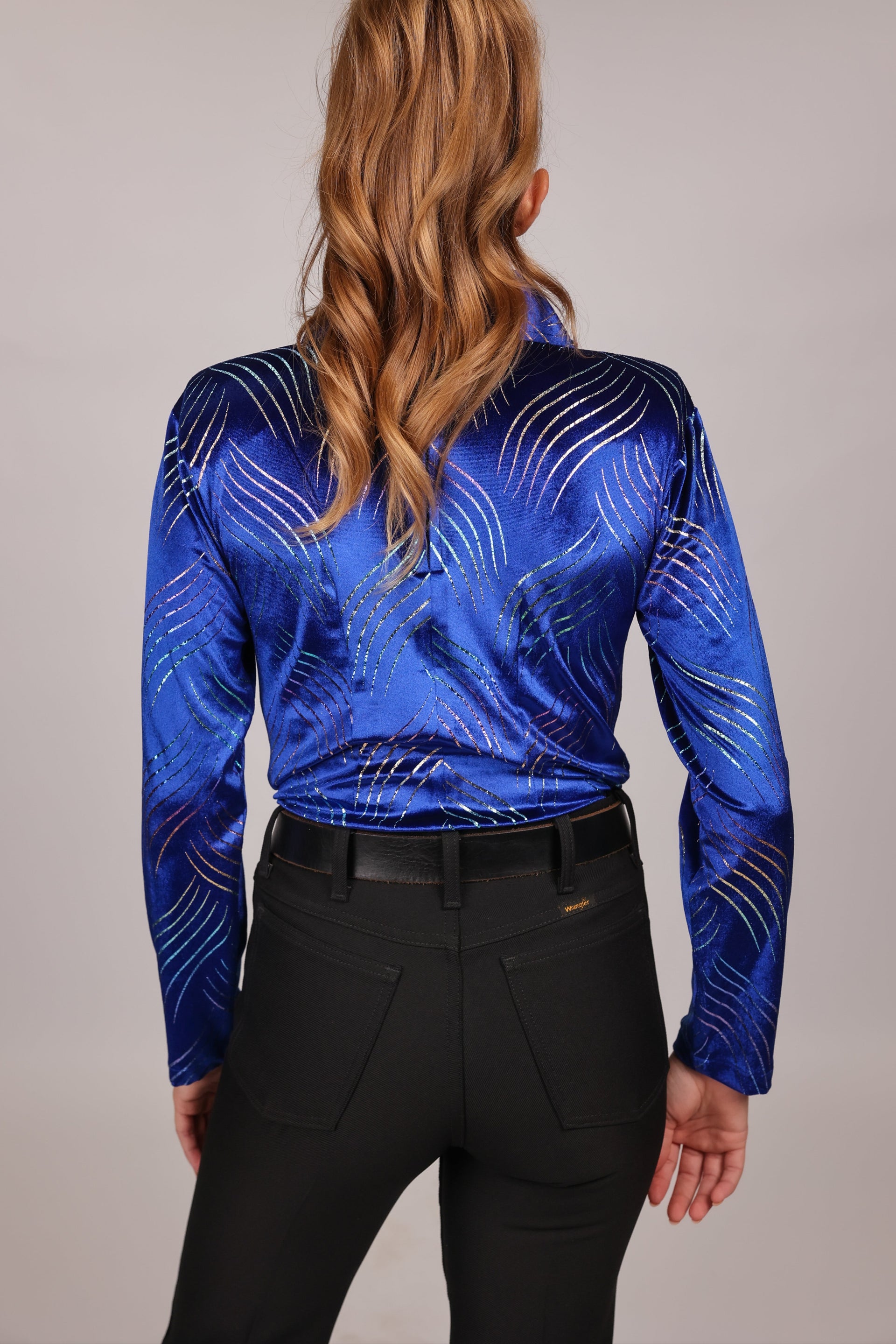 Model posing in blue shirt from velvet whisper collection by Kultured Rider