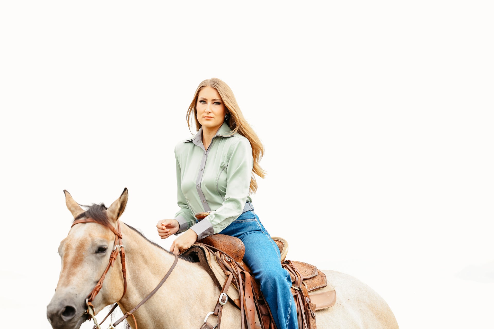 Model on horse posing in Carlee Mint Shirt by Kultured rider