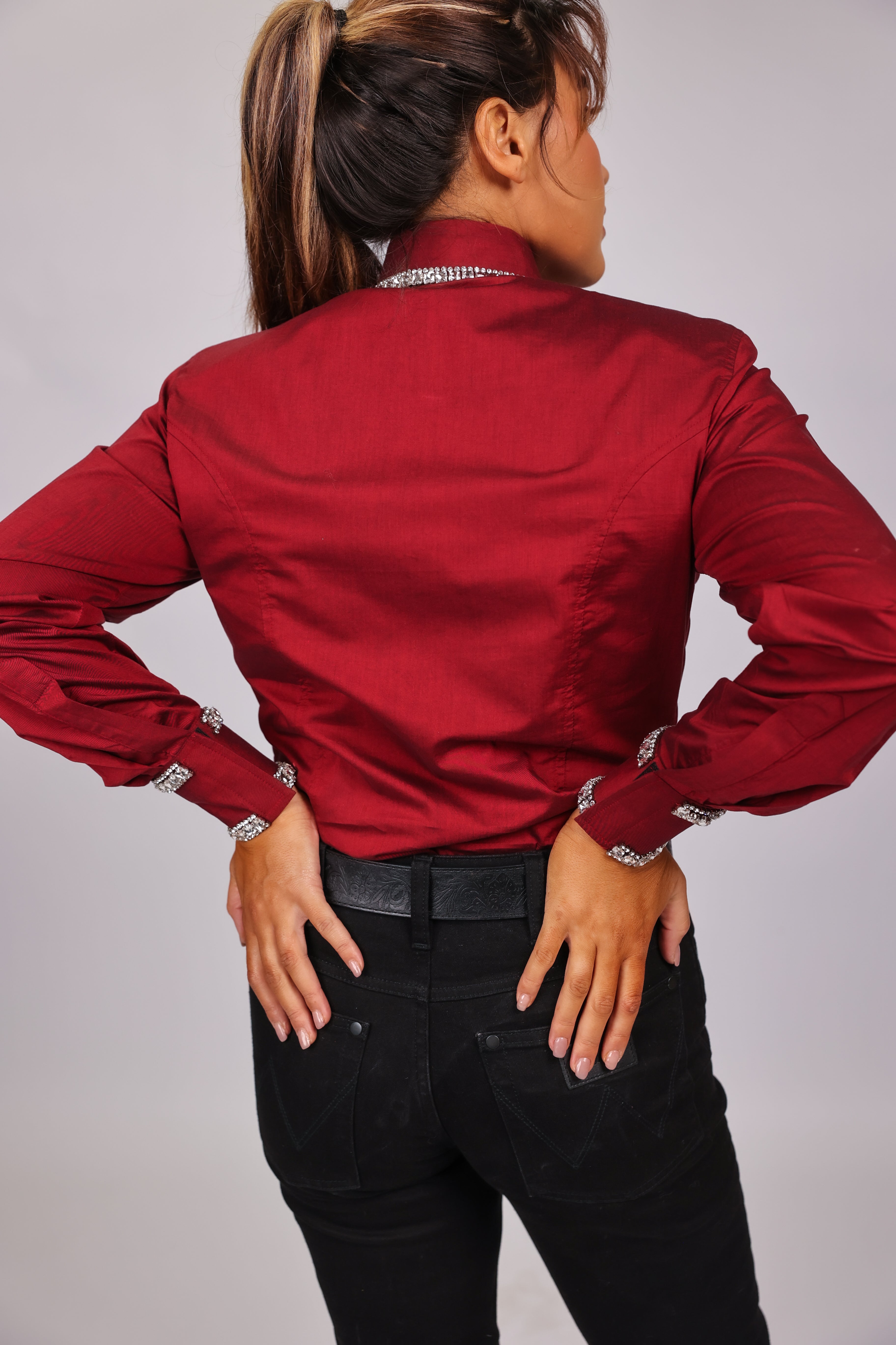 Model posing in studio setting wearing Diamond shirt from urban cowgirl collection by Kultured rider, displaying the back of the shirt.