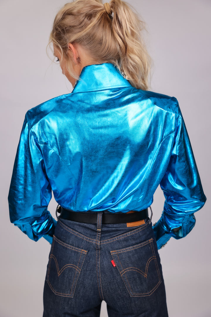 Model posing in studio setting wearing Ice shirt from urban cowgirl collection by Kultured rider, displaying the back of the shirt.