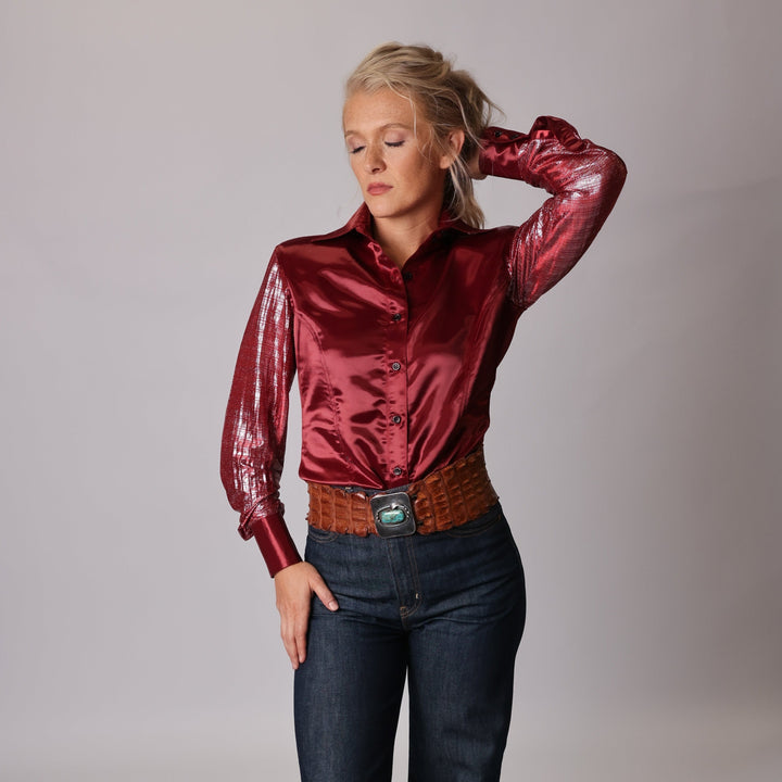 Model posing in studio setting wearing Garnet shirt from Kultured Rider's jewel collection.