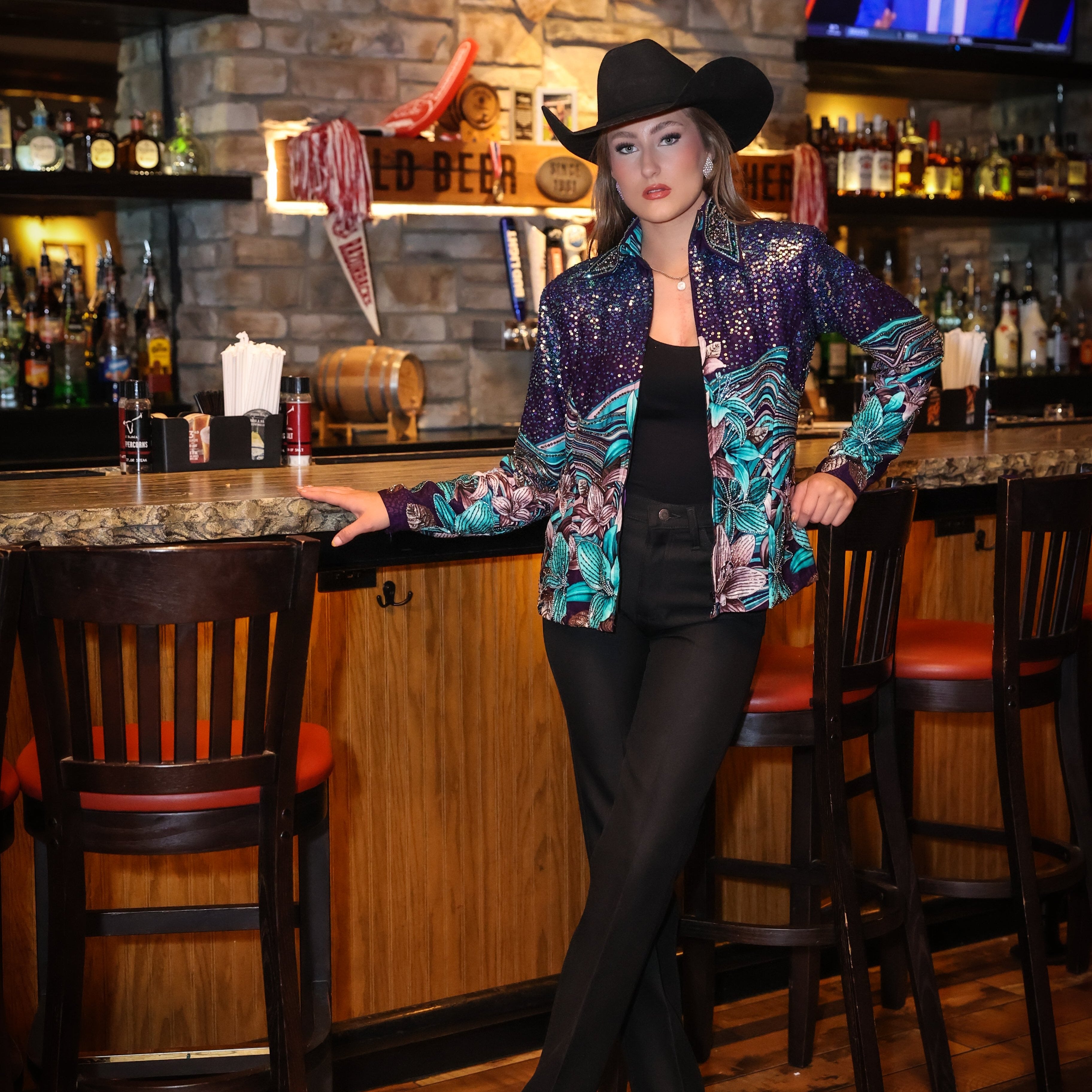 Model posing in bar wearing Lily jacket by Kultured rider