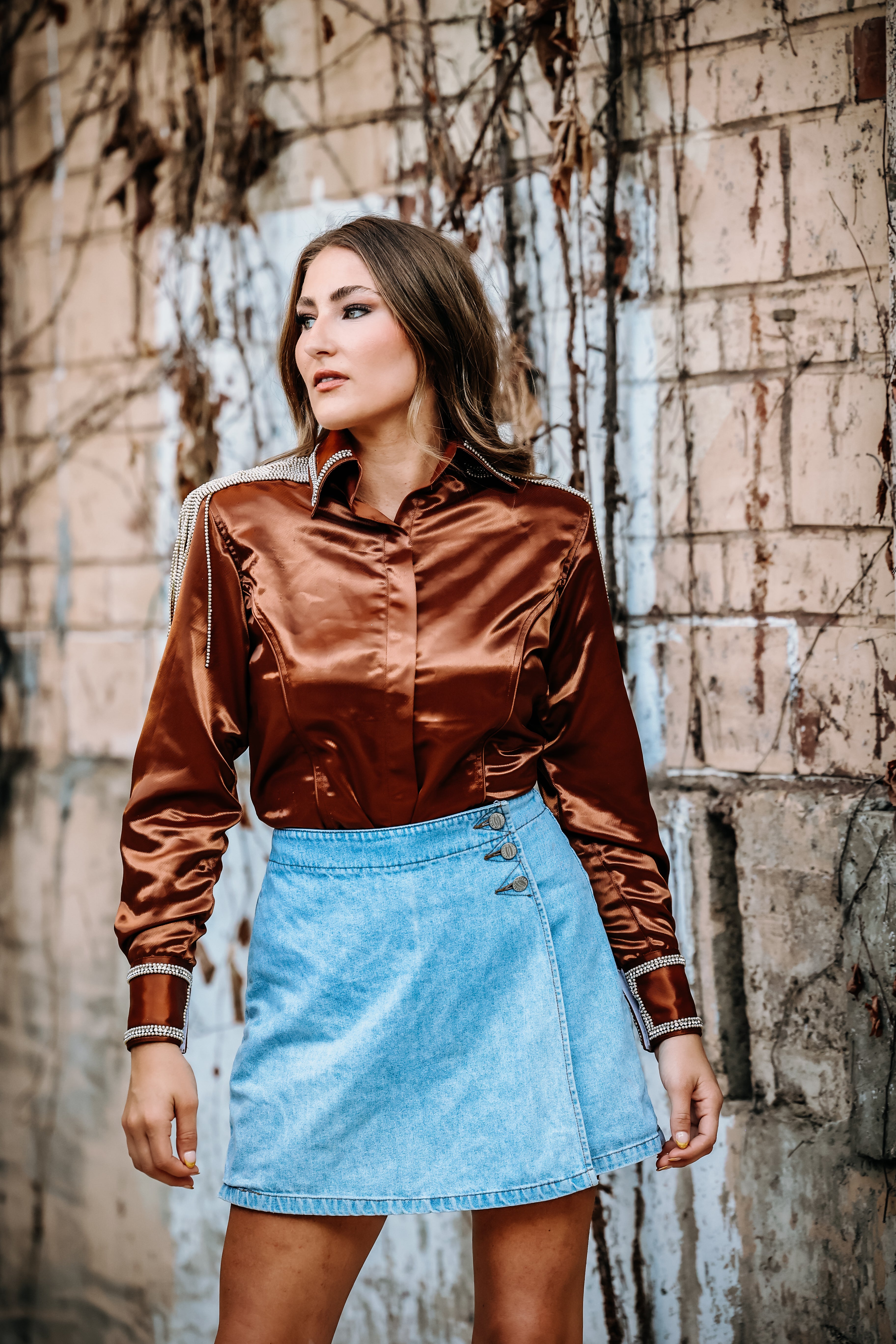 Model posing in copper shirt from urban Cowgirl by Kultured Rider