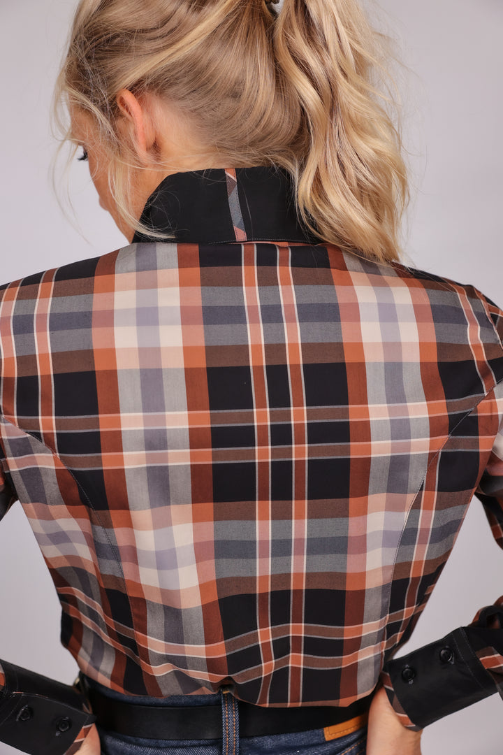 Model posing in plaid brown riding shirt from the Essentials collection by Kultured Rider, displaying the back