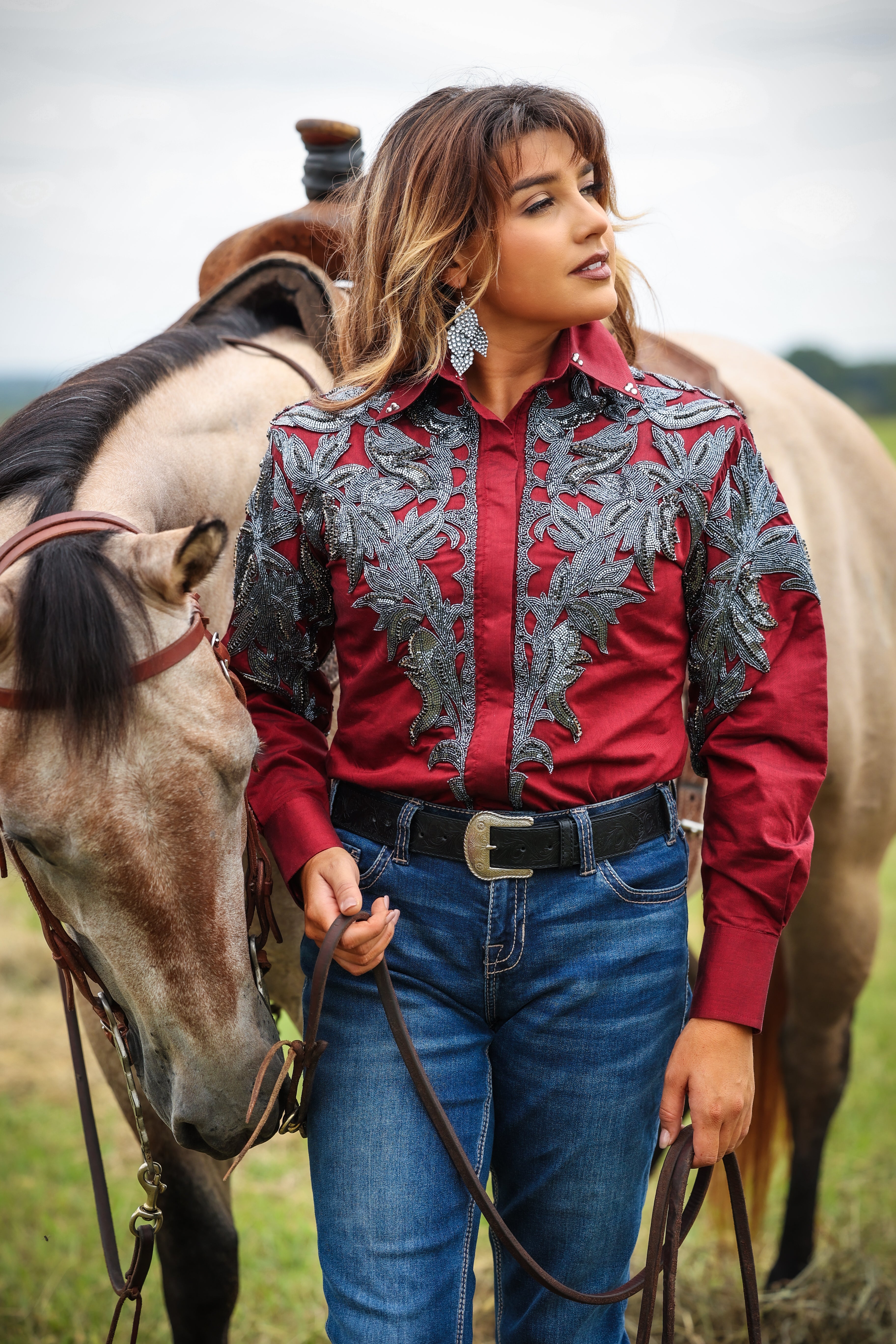 Model with horse posing in Red Gunmetal blouse by Kultured Rider