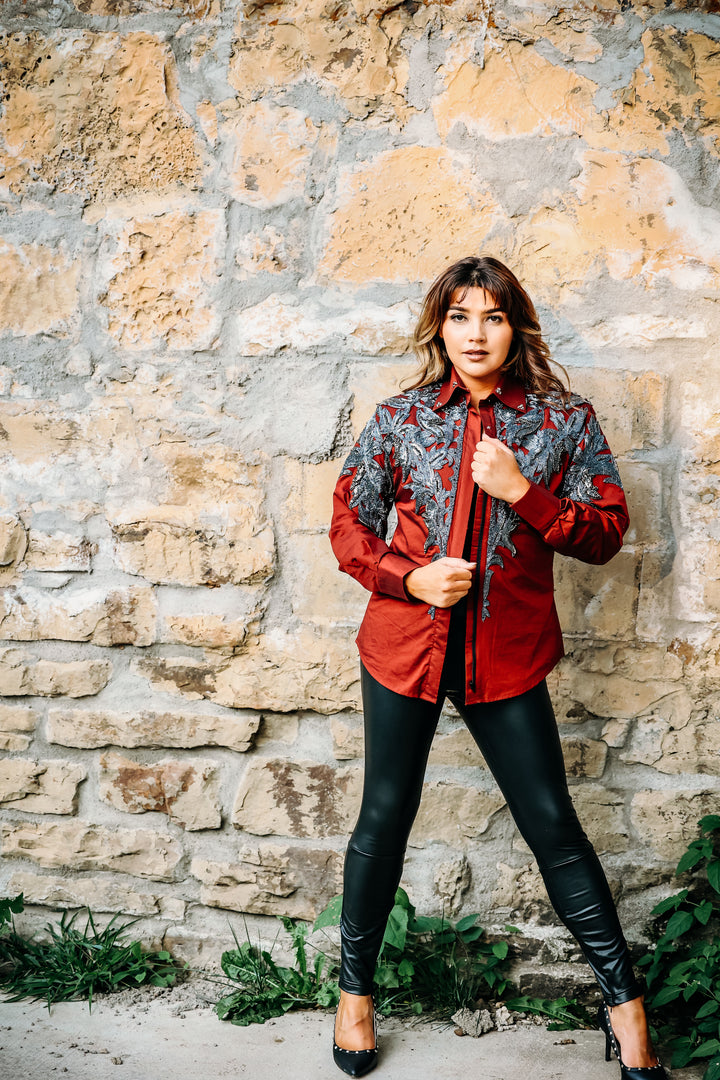 Model posing in Red Gunmetal blouse by Kultured Rider