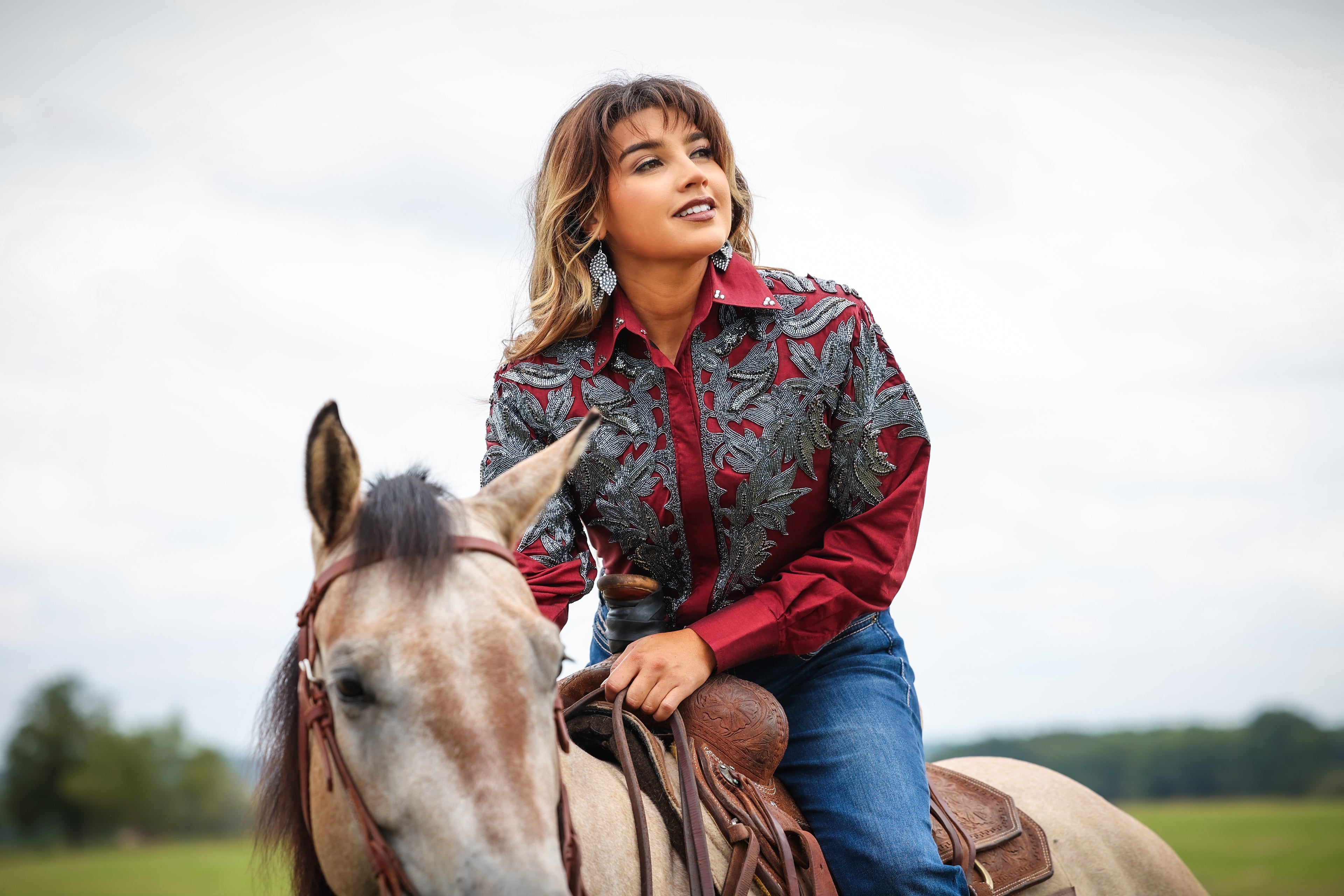 Model with horse posing in Red Gunmetal blouse by Kultured Rider