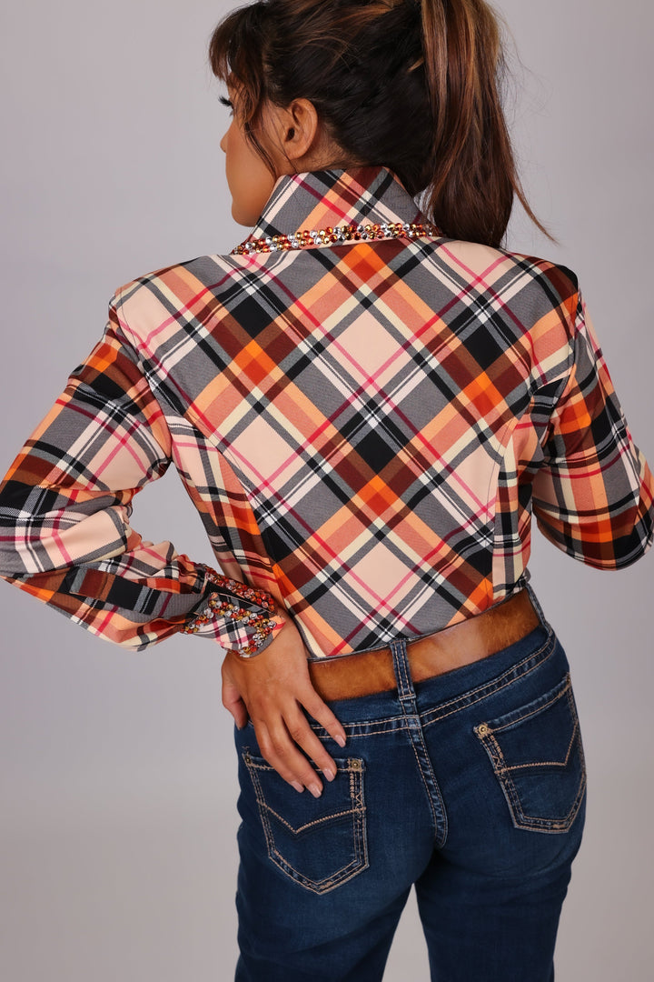 Model in studio setting posing in Orange shirt from Shanena collection by Kultured rider