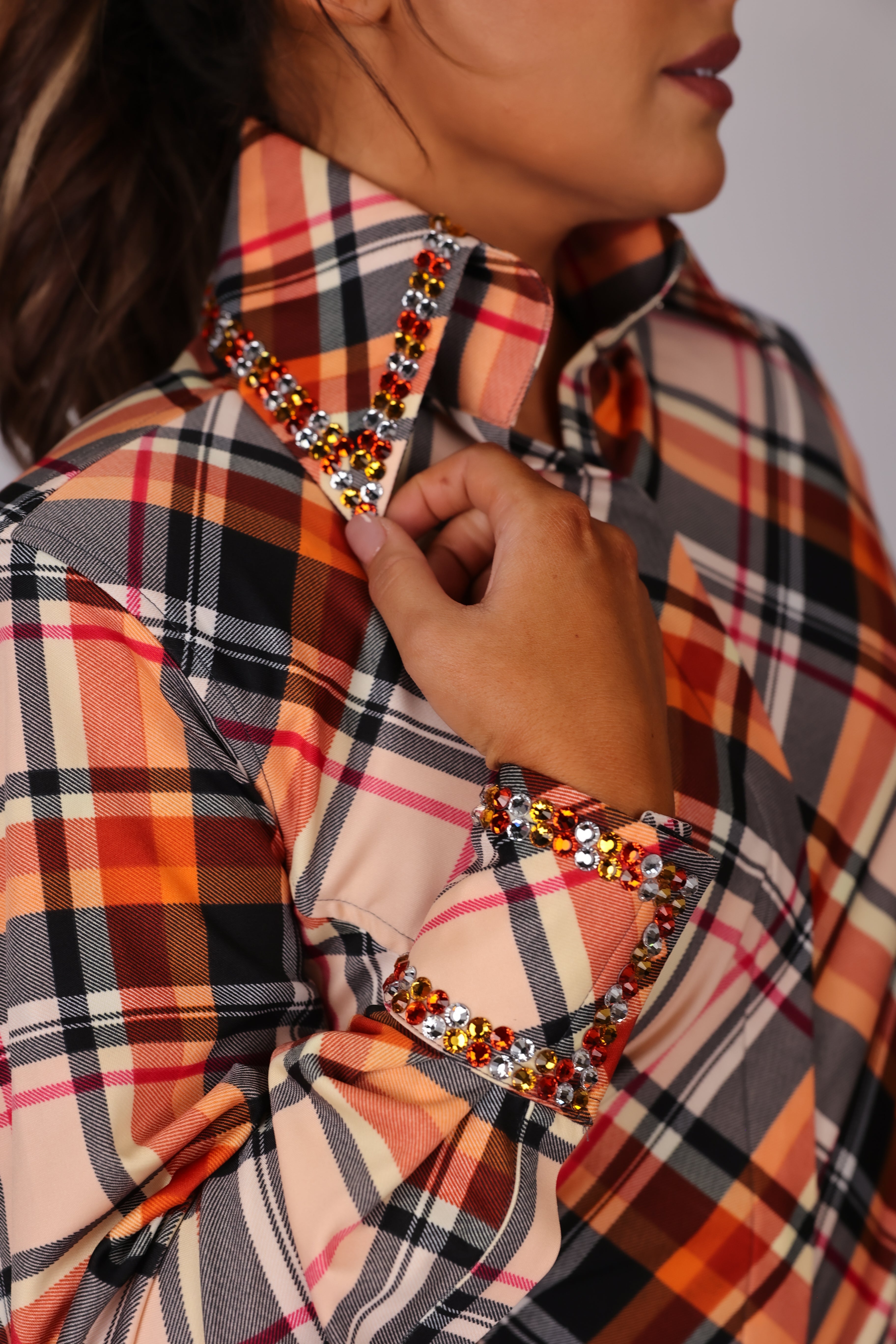 Model in studio setting posing in Orange shirt from Shanena collection by Kultured rider