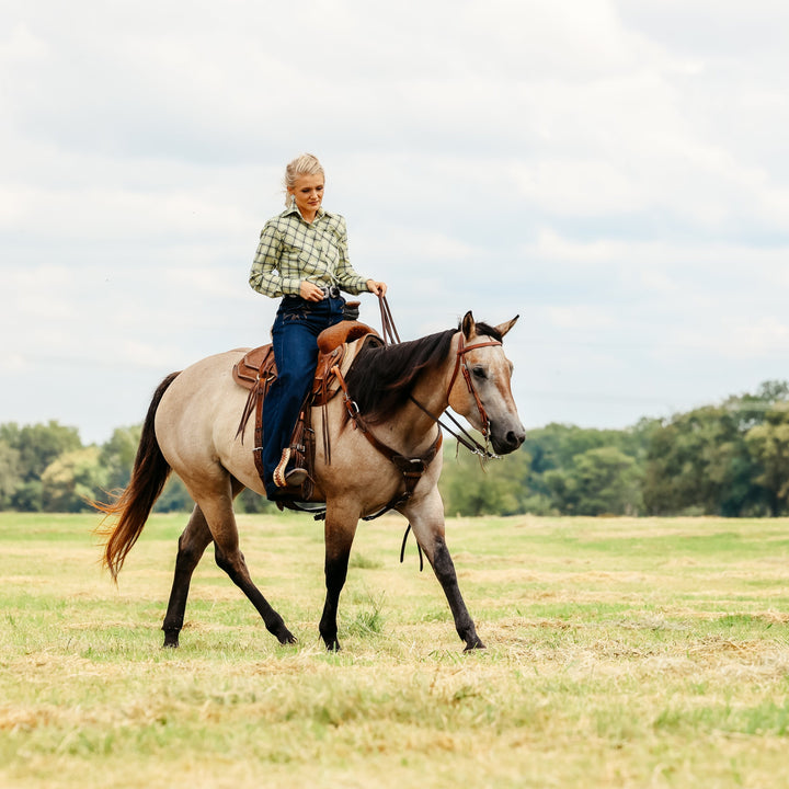 Model on horse posing in Shanena Yellow riding shirt by Kultured Rider