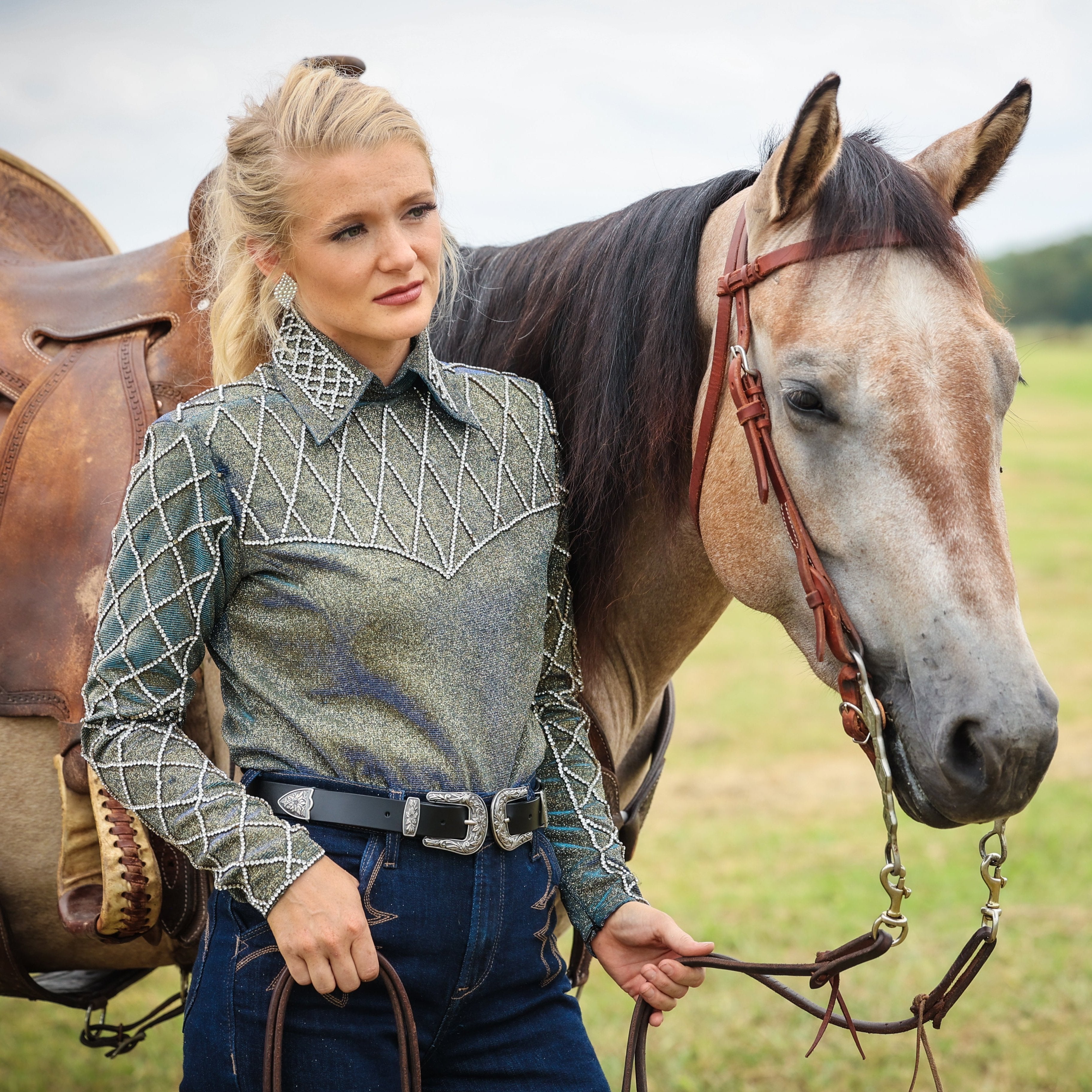 Model posing with horse in Silver back zip riding shirt by Kultured Rider