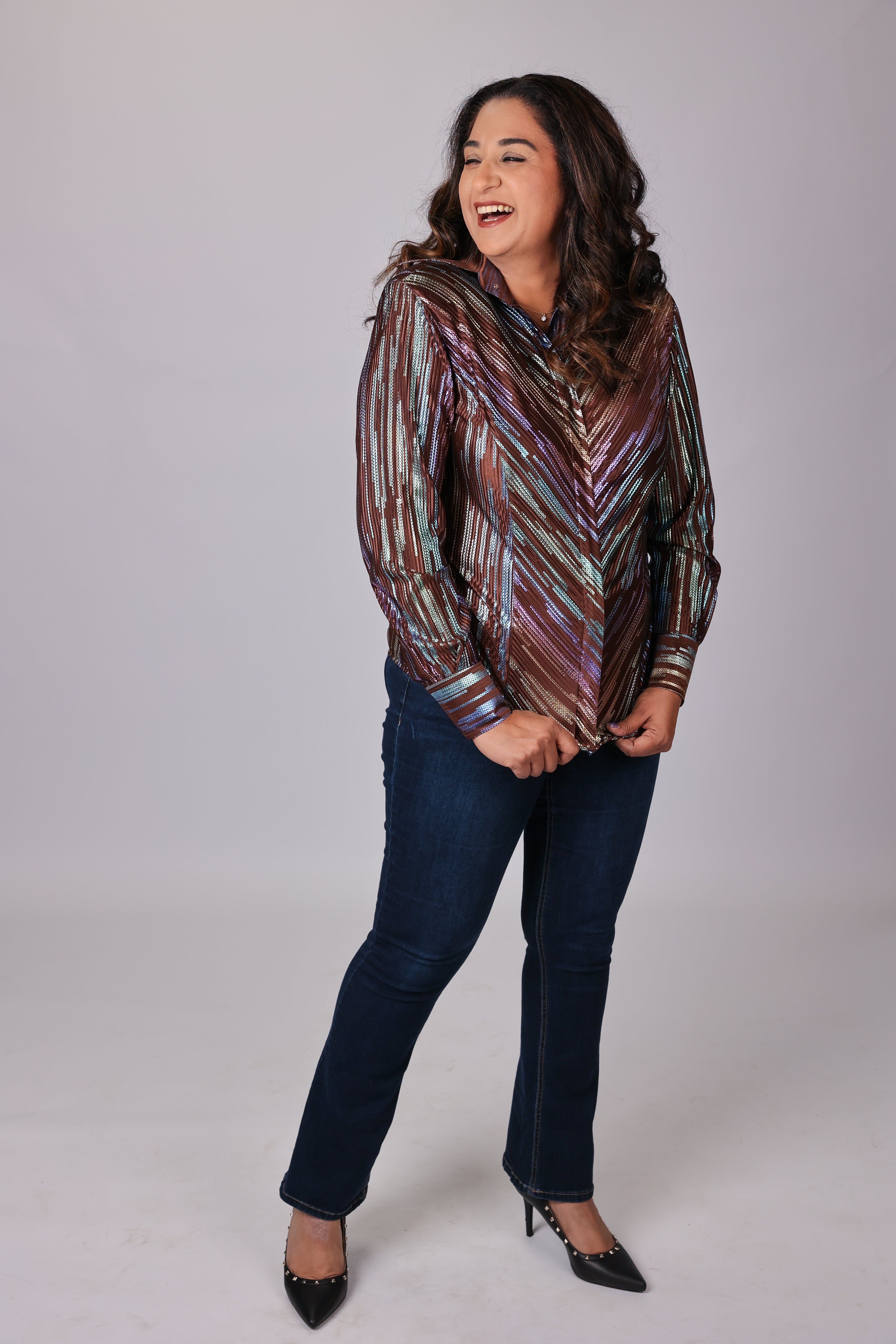 Model posing in studio setting with spankol brown shirt by Kultured rider