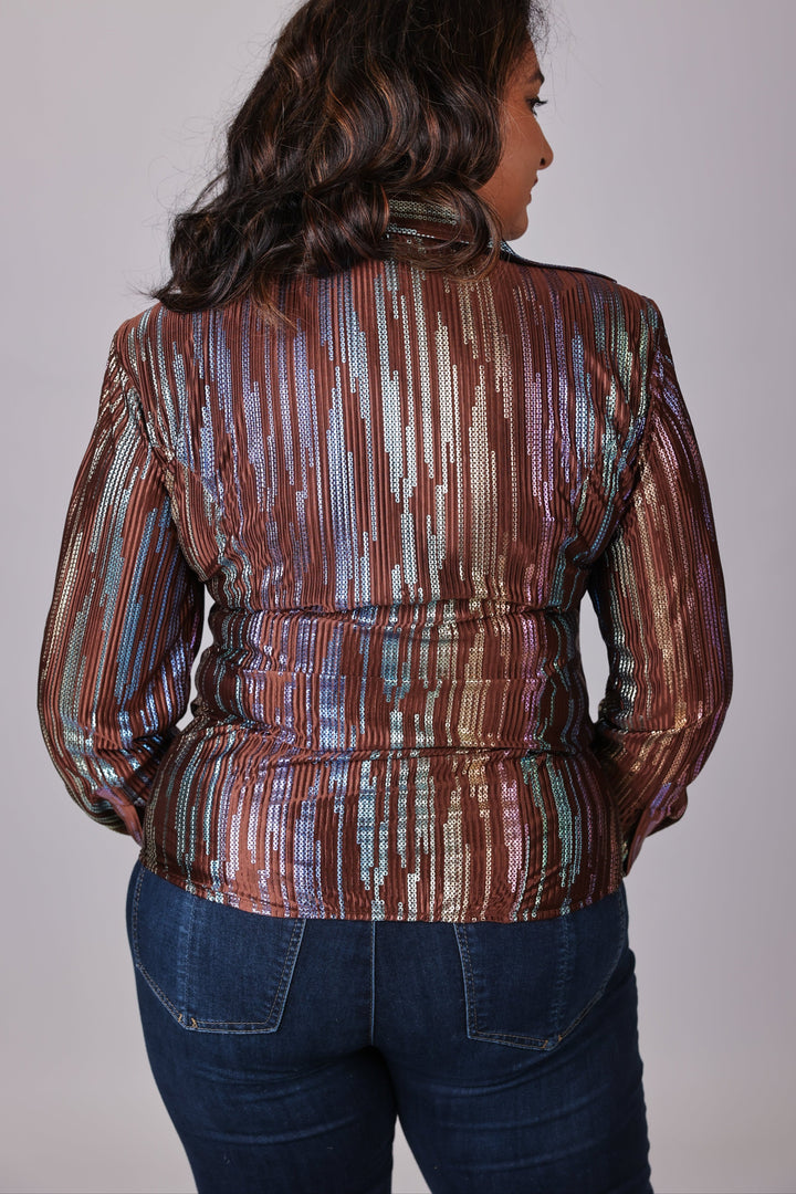 Model posing in studio setting with spankol brown shirt by Kultured rider
