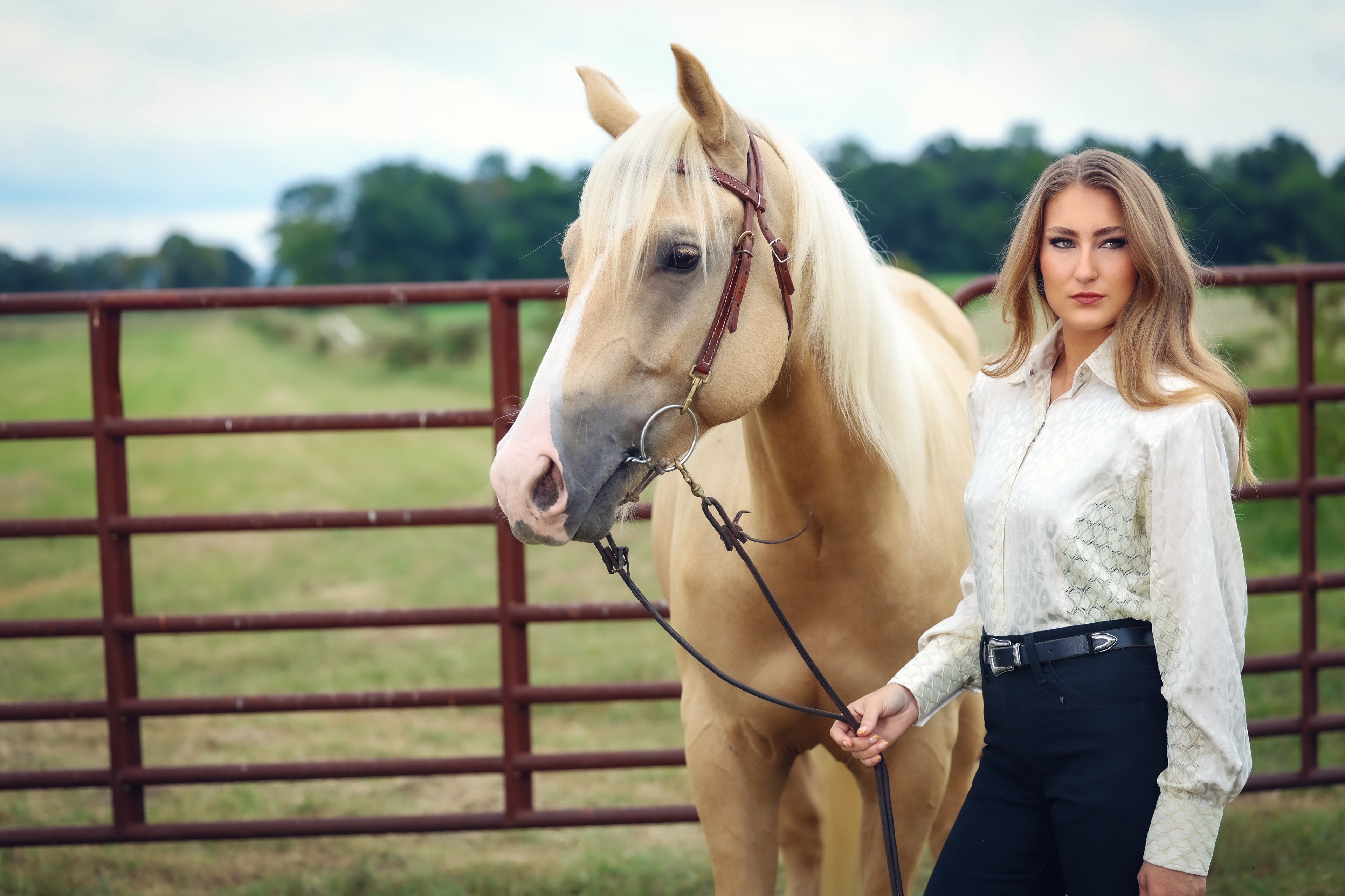 Model poses with Horse in White Lace riding shirt by Kultured rider