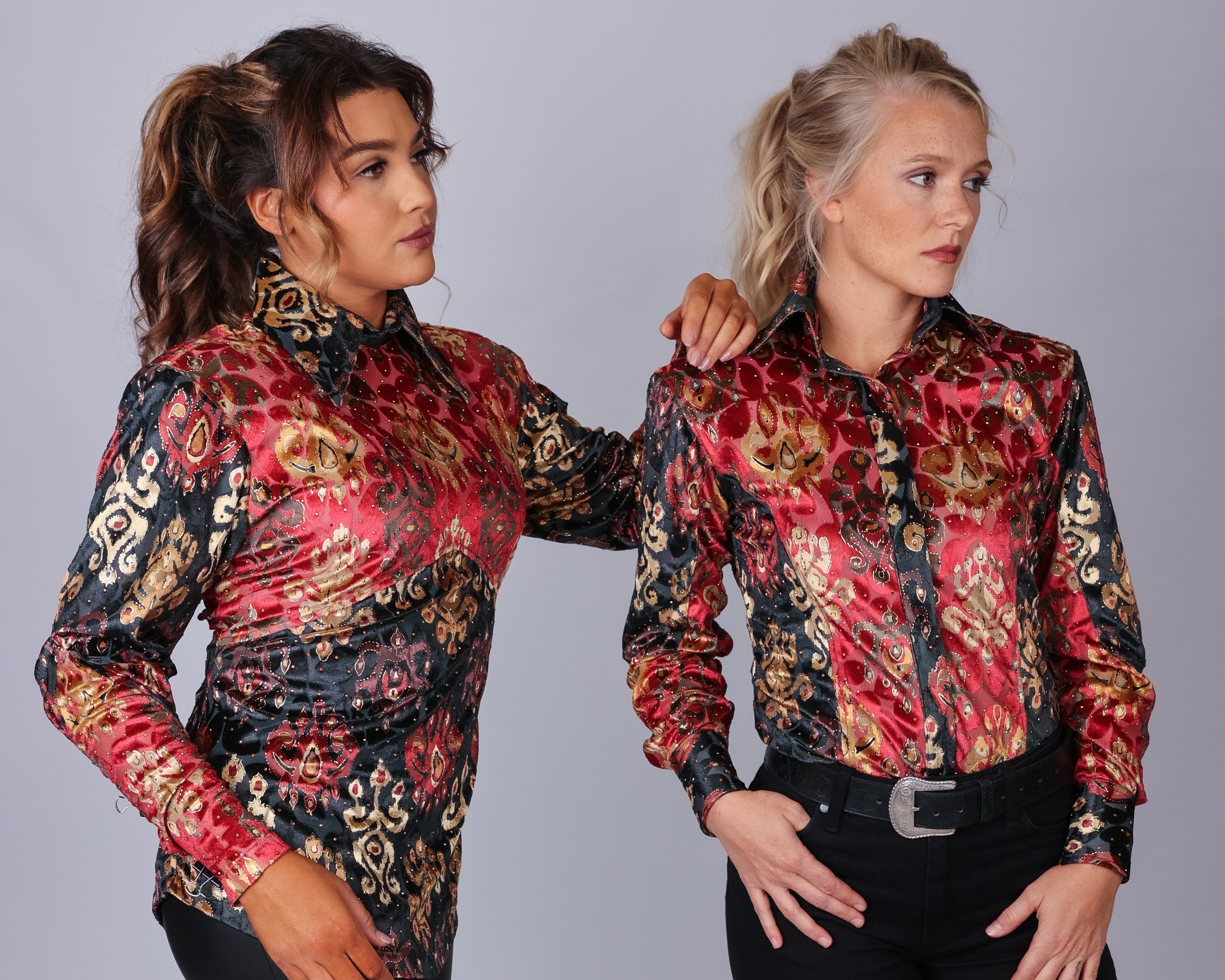 Two models pose in red and black riding shirt collection by Kultured Rider